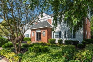 Brick entry to an apartment building with trees